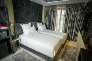MAGNIFIQUE HOTEL客房内的一张或多张床位
