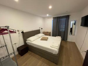 a bedroom with a bed and a ladder in it at Villa Godinovic in Hvar