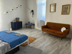 a living room with a couch and a bed at Maleth House in Naxxar +61 photos