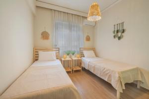 Postel nebo postele na pokoji v ubytování Bohemian Paradise Villa