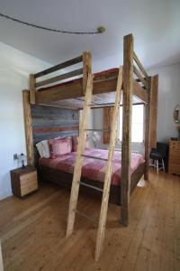Poschodová posteľ alebo postele v izbe v ubytovaní Auberge Carpe Diem