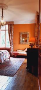 Postel nebo postele na pokoji v ubytování Le Château du Breuil