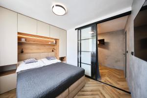 Ένα ή περισσότερα κρεβάτια σε δωμάτιο στο Apartmán u Lipna-Frymburk 5