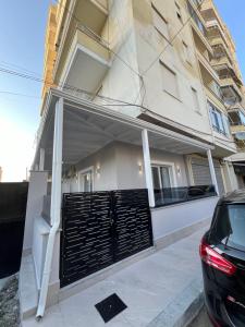 a building with a gate in front of it at Marina Luxury Apartments Iliria in Durrës