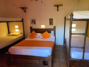 Postel nebo postele na pokoji v ubytování La Casa del Viajero Mompos