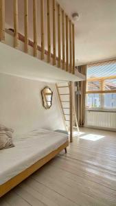Ένα ή περισσότερα κρεβάτια σε δωμάτιο στο Maisonette-Loft: 4 Schlafzimmer