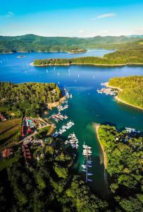 an aerial view of a marina with boats in the water at Polańczyk Dom, Apartamenty - Leśny Domek Polańczyk in Polańczyk