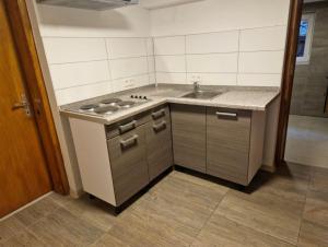 a kitchen with a sink and a counter top at Laubach Apartments in Laubach