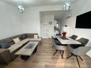 a living room with a couch and a table at Apartment Simon 01 in Bar