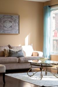 a living room with a couch and a coffee table at 4br Near Hilton Falls - Kelso - Gazebo, Workspace in Milton +27 photos
