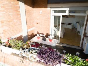 a patio with a white table and some plants at Luxury Rome Guest House in Rome