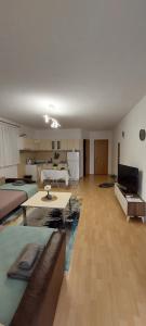 a large living room with a couch and a table at Knezevic House in Gevgelija