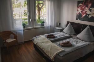 En eller flere senge i et værelse på Ferienwohnung Zentrum - Albert