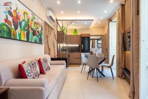 a living room with a couch and a table at Terra dell'Etna in Catania