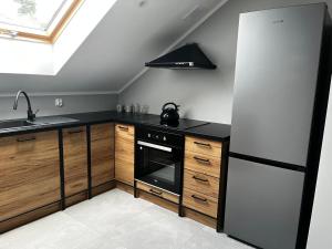 Kuchyň nebo kuchyňský kout v ubytování Beskid Rest Apartments