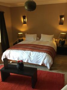 Ένα ή περισσότερα κρεβάτια σε δωμάτιο στο The Capaldi Hotel, Restaurant & Spa