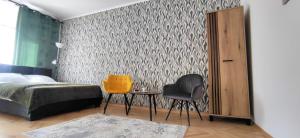 Posteľ alebo postele v izbe v ubytovaní Apartament przy Parku