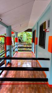 a view of a empty room with a wooden floor at Lucia Guesthouse in San Juan