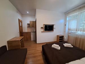 a room with a bed with two towels on it at Solomiia in Solochyn