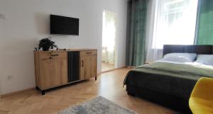 Posteľ alebo postele v izbe v ubytovaní Apartament przy Parku