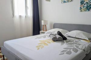 En eller flere senge i et værelse på Appartement Malendure Bay