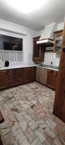 a kitchen with a tiled floor in a room at Adam room 7 in Wrocław +7 photos