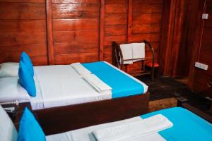 Postel nebo postele na pokoji v ubytování Ceylon Amigos Eco Resort