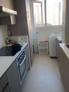 Una cocina o zona de cocina en Cómodo depto concón