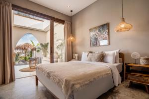 Ένα ή περισσότερα κρεβάτια σε δωμάτιο στο Villa Bayu by Alfred in Bali