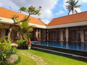 an image of a villa with a swimming pool at Puri Abian Ari in Tirtagangga