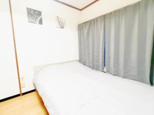 Postel nebo postele na pokoji v ubytování 西武新宿線 駅近最大4人d2