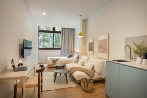 a living room with a couch and a table at Alma House in Singapore