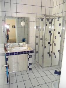 a bathroom with a shower and a sink at villa marisa by salentolimit in Torre Lapillo