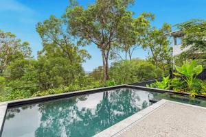 an image of a swimming pool in a house at Hilltop Hideaway at Coolum Beach in Coolum Beach