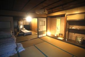 Postel nebo postele na pokoji v ubytování 民泊 菅田 金物屋のおばあちゃんち 下呂市金山町菅田