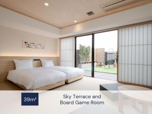 a bedroom with a bed and a board game room at MIMARU Osaka Namba Station in Osaka