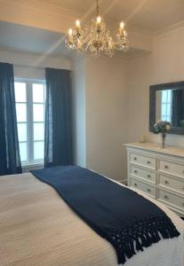 Ένα ή περισσότερα κρεβάτια σε δωμάτιο στο Villas de Lago Central Hamilton