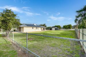a fence in front of a yard with a house at Shepherds Delight-Access Friendly-Linen Included in Goolwa South
