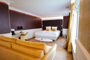 Postel nebo postele na pokoji v ubytování Hôtel Merveilleux Côté Mer