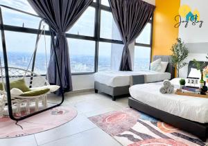 two beds in a room with large windows at Atlantis Residence l Luxury 3BR l 8-12pax l Jonker St l City Centre by Jay Stay in Melaka +119 photos