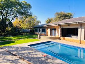 a swimming pool in the backyard of a house at TAG@12A in Piet Retief