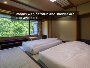 Vuode tai vuoteita majoituspaikassa KAMENOI HOTEL Nikko Yunishigawa All-Inclusive Resort