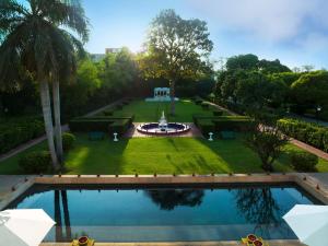 an aerial view of a garden with a swimming pool at Taj Nadesar Palace in Varanasi