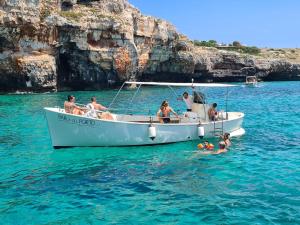 a group of people on a boat in the water at Casa vacanza Tanja Leuca in Leuca