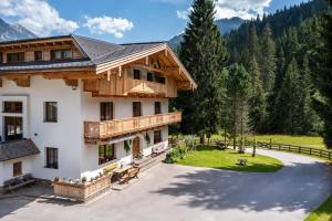 an aerial view of a house in the mountains at Pension Walchauhof in Flachau