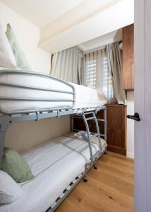 En eller flere senge i et værelse på Sopelana Beach Aparment!