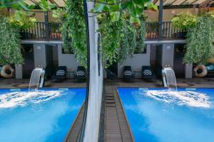 two pools in the courtyard of a hotel at Seventeen Rooms in Tʼelavi