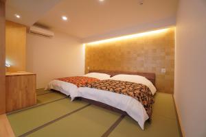 Letto o letti in una camera di Bird Hostel Palace Side Suite