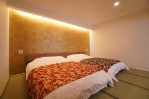 Letto o letti in una camera di Bird Hostel Palace Side Suite