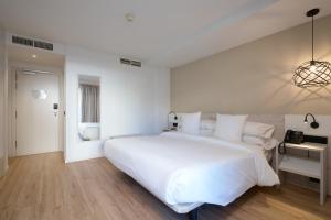 Кровать или кровати в номере Óbal Hotel Marbella